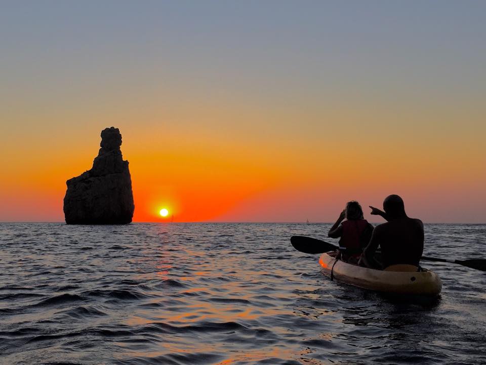 Sunset kayaking at Cala Benirras